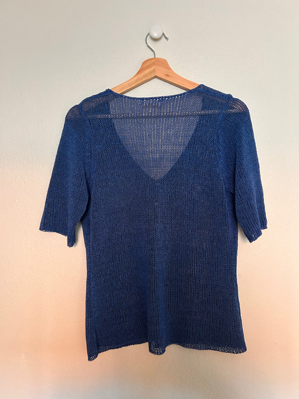 Strik T-cardigan med perlemorknapper